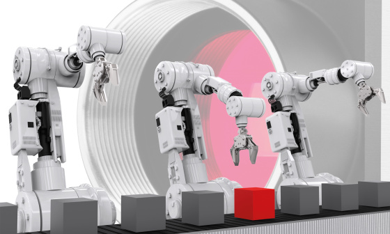 Illustration de robots se tenant devant une caméra et saisissant des cubes sur un tapis roulant.