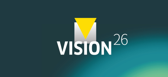 Graphisme avec l'inscription « VISION26 » sur fond bleu-vert.