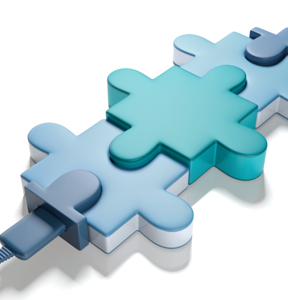 3 pièces de puzzle reliées par un câble en bas à gauche