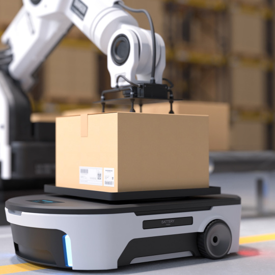 Un bras robotisé place un carton sur un robot qui se déplace lui-même.