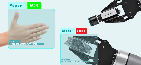 Une main humaine et un bras robotique font un geste, la caméra IDS NXT en fait l’analyse.