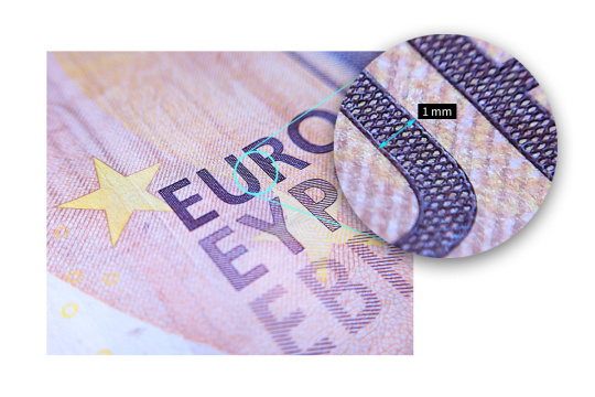 Un champ agrandi sur un billet en euro montre le zoom de la uEye XC.