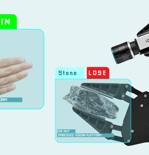 Une main humaine et un bras robotique font un geste, la caméra IDS NXT en fait l’analyse.